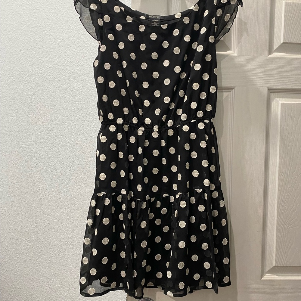 Polka dot sleeveless black and white dress with elastic waist. Size Large